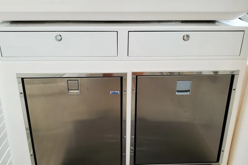 Her Salt Bouys Yacht Photos Pics 2019 Intrepid 475 Sport Yacht interior with stainless steel drawers and cabinets.