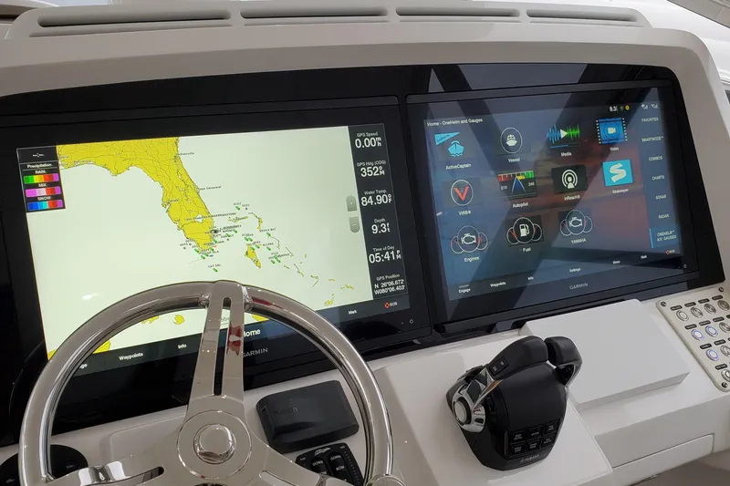 Her Salt Bouys Yacht Photos Pics Control panel of 2019 Intrepid 475 Sport Yacht with navigation and system displays.