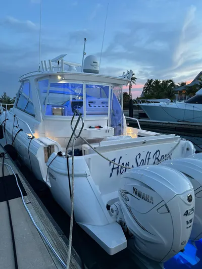 Her Salt Bouys Yacht Photos Pics 2019 Intrepid 475 Sport Yacht docked at sunset with Yamaha engines.