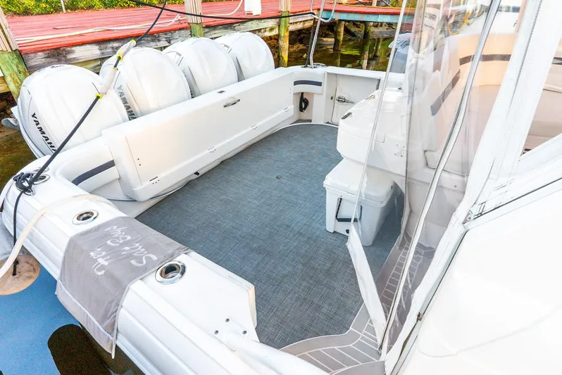 Her Salt Bouys Yacht Photos Pics 2019 Intrepid 475 Sport Yacht with Yamaha engines, docked, featuring spacious deck area.