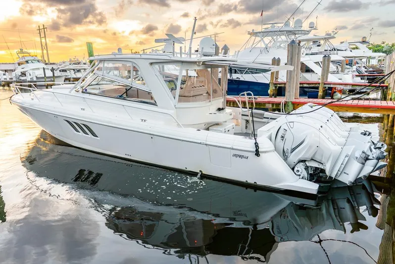 Her Salt Bouys Yacht Photos Pics 2019 Intrepid 475 Sport Yacht docked at marina during sunset.