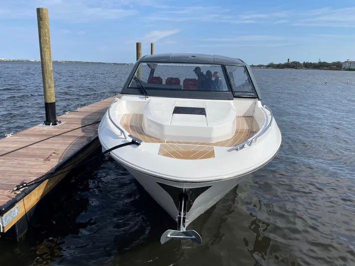 Inventory Clearance Yacht Photos Pics 2023 Bavaria Vida 33 boat docked on calm water under a clear sky.