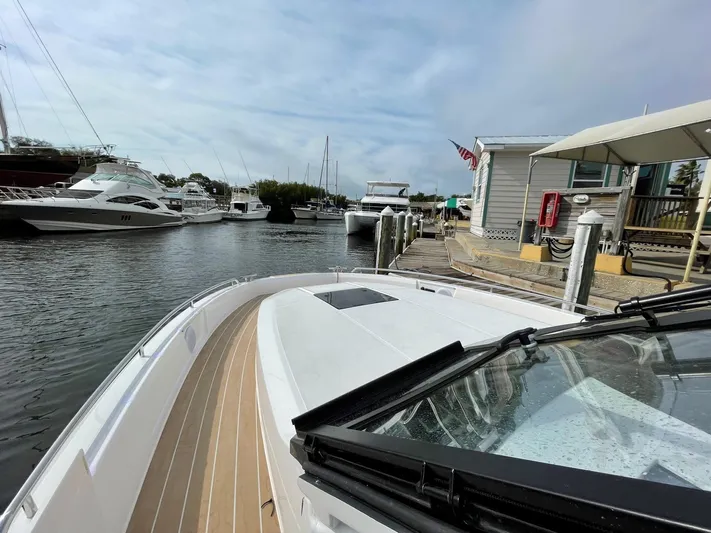 Inventory Clearance Yacht Photos Pics Bavaria Vida 33 boat docked at marina, surrounded by other yachts, 2023 model.