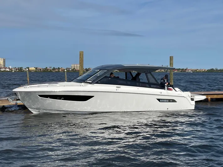 Inventory Clearance Yacht Photos Pics 2023 Bavaria Vida 33 boat docked on calm water under a clear sky.