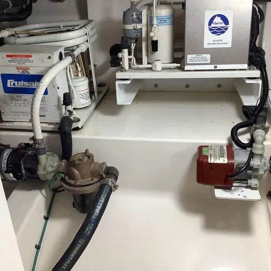 Lauralea Yacht Photos Pics Engine room of 2006 Cabo 35 Flybridge Sportfisher with marine refrigeration and cooling systems.