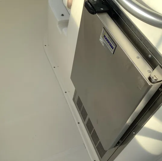 Lauralea Yacht Photos Pics 2006 Cabo 35 Flybridge Sportfisher with Raritan marine refrigerator in cockpit area.