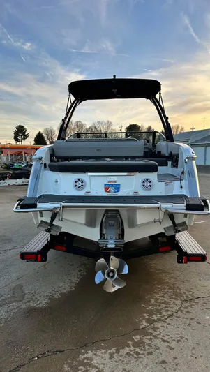  Yacht Photos Pics 2022 Cobalt R8 boat, rear view, showcasing sleek design and dual propellers.