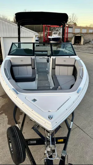  Yacht Photos Pics 2022 Cobalt R8 boat on trailer, sleek design, spacious seating, black canopy.