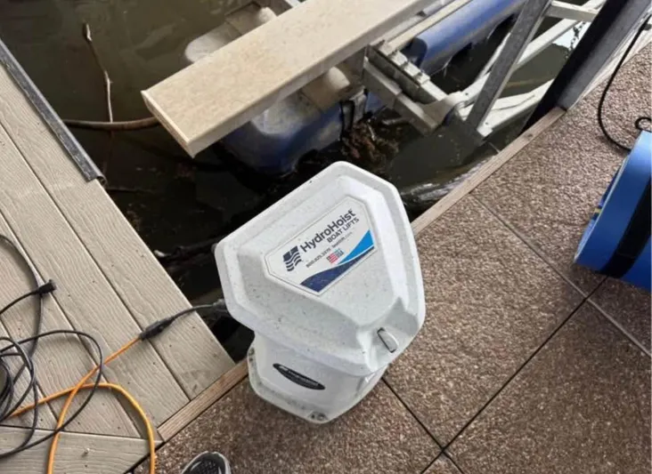  Yacht Photos Pics HydroHoist boat lift control unit on dock near water, Cobalt R8, 2022 model.