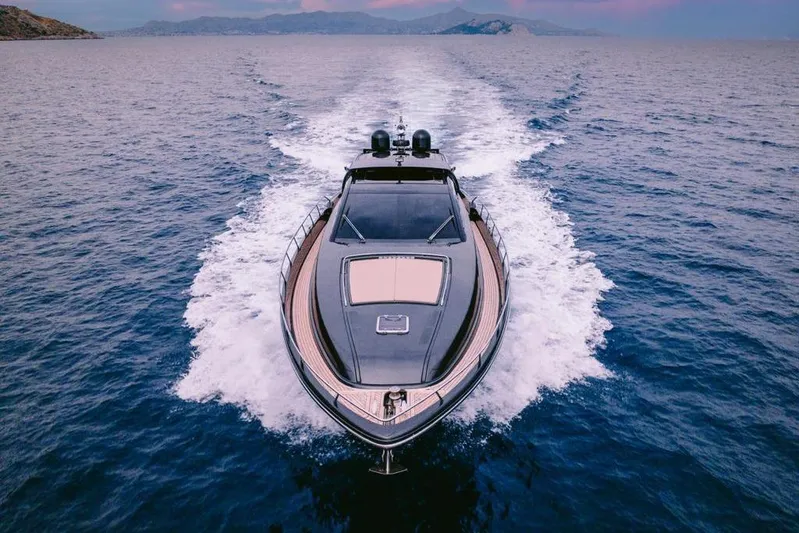  Yacht Photos Pics Luxury 2006 Riva 68 Ego yacht cruising on open sea at sunset.