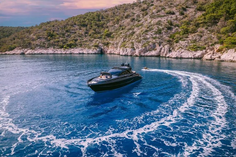  Yacht Photos Pics Luxurious 2006 Riva 68 Ego yacht cruising in scenic coastal waters.