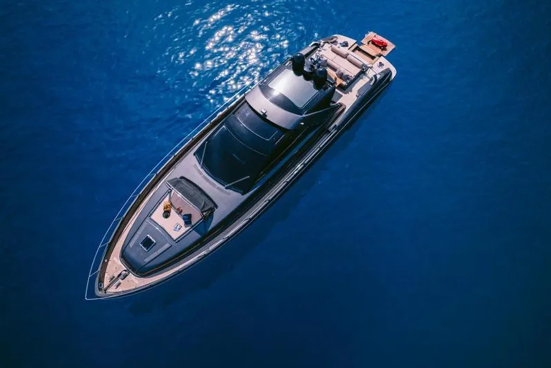  Yacht Photos Pics Aerial view of 2006 Riva 68 Ego yacht on calm blue water.