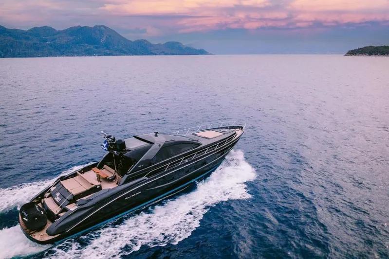  Yacht Photos Pics Luxurious 2006 Riva 68 Ego yacht cruising on serene waters at sunset.