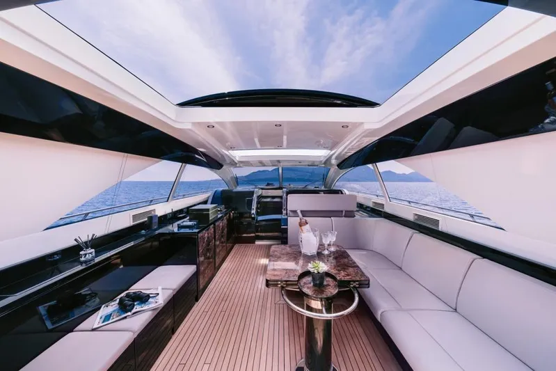  Yacht Photos Pics Luxurious interior of 2006 Riva 68 Ego yacht with elegant seating and ocean view.