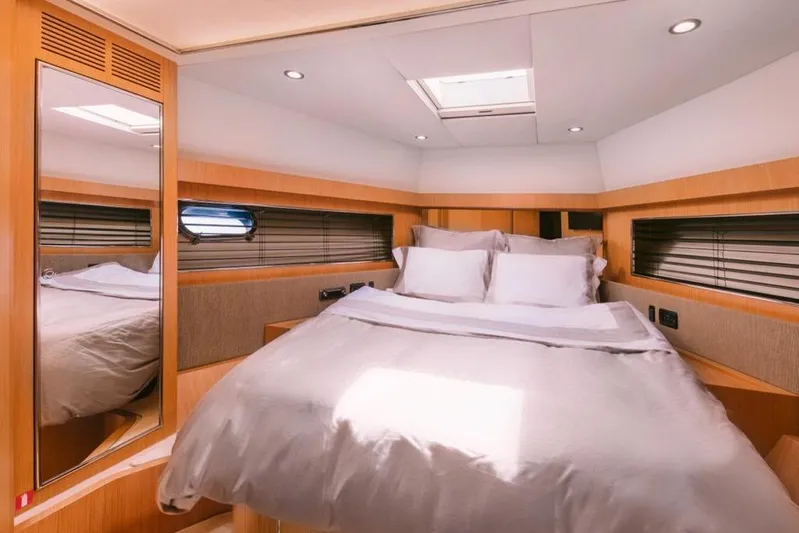  Yacht Photos Pics Luxurious bedroom interior of 2006 Riva 68 Ego yacht with modern design and skylight.