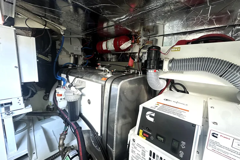 Lady Jane III Yacht Photos Pics Engine room of 2023 Prestige 520 yacht with Cummins generator and fire safety equipment.