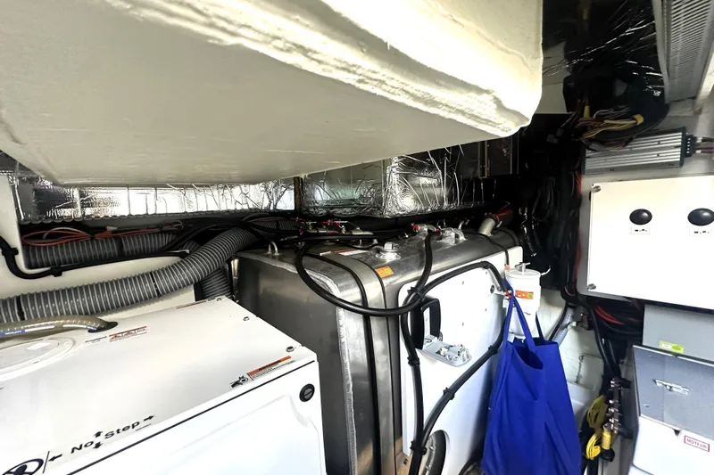 Lady Jane III Yacht Photos Pics Engine room of 2023 Prestige 520 yacht with mechanical components and wiring.