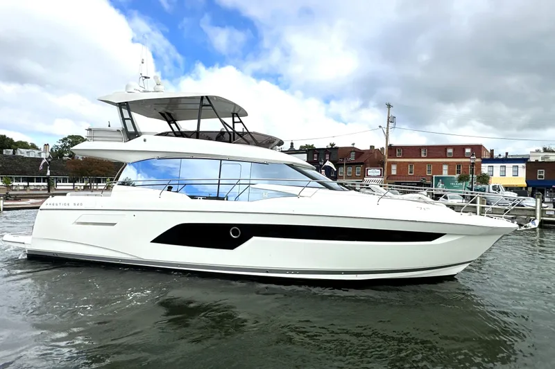 Lady Jane III Yacht Photos Pics 2023 Prestige 520 yacht docked in a marina under cloudy skies.