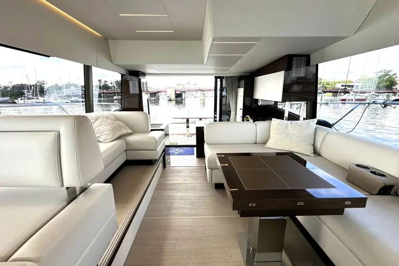 Lady Jane III Yacht Photos Pics Luxurious interior of 2023 Prestige 520 yacht with elegant seating and modern design.