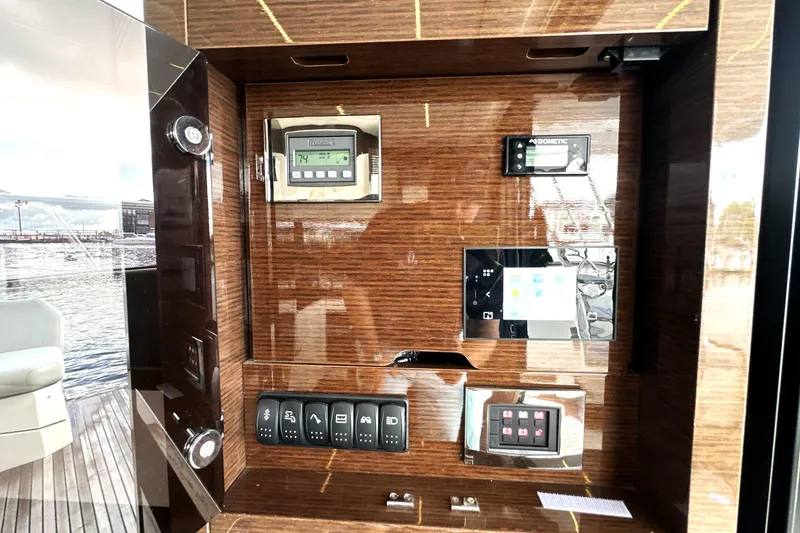 Lady Jane III Yacht Photos Pics Control panel of 2023 Prestige 520 yacht with digital displays and switches.