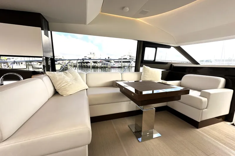 Lady Jane III Yacht Photos Pics Luxurious interior of 2023 Prestige 520 yacht with elegant seating and modern design.