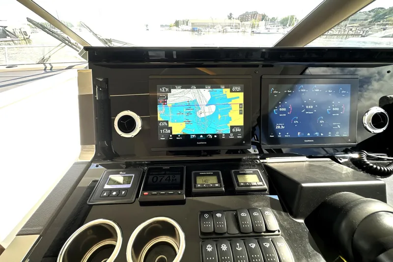 Lady Jane III Yacht Photos Pics Control panel of 2023 Prestige 520 yacht with navigation and monitoring screens.