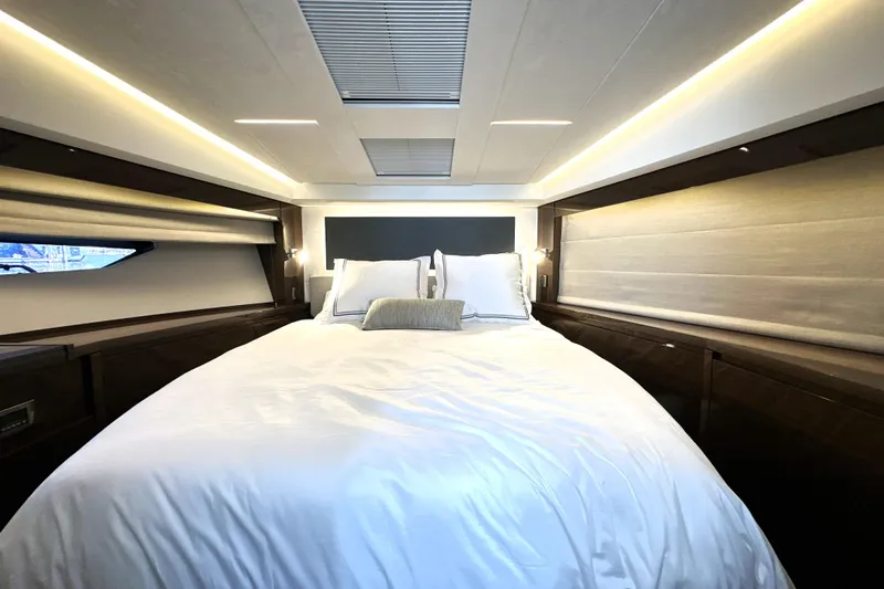 Lady Jane III Yacht Photos Pics Luxurious bedroom interior of 2023 Prestige 520 yacht with elegant lighting and modern design.