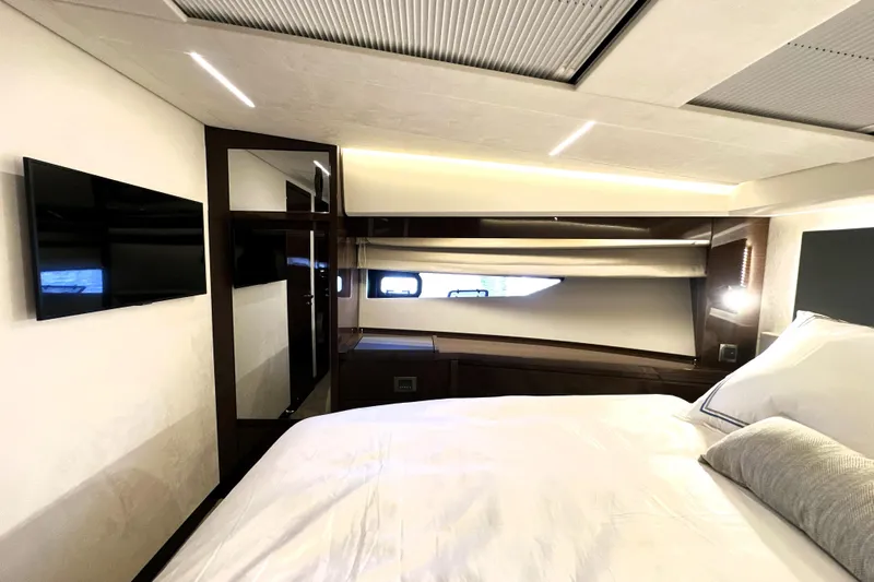 Lady Jane III Yacht Photos Pics Luxurious interior of 2023 Prestige 520 yacht bedroom with modern design and amenities.