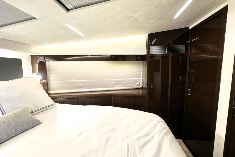 Lady Jane III Yacht Photos Pics Luxurious interior of 2023 Prestige 520 yacht bedroom with modern design and ambient lighting.