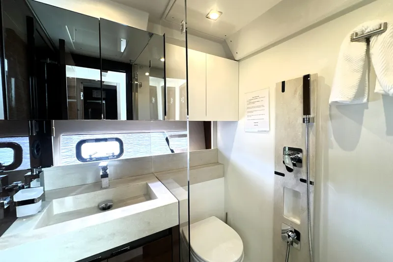 Lady Jane III Yacht Photos Pics Luxurious bathroom in 2023 Prestige 520 yacht with modern fixtures and elegant design.
