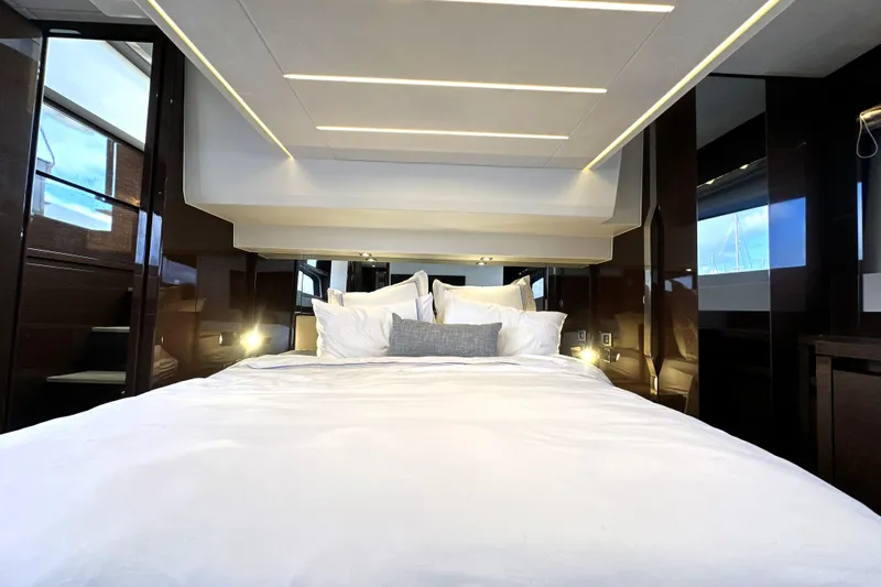 Lady Jane III Yacht Photos Pics Luxurious bedroom interior of 2023 Prestige 520 yacht with modern design and ambient lighting.