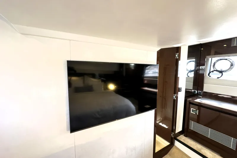 Lady Jane III Yacht Photos Pics Luxurious interior of 2023 Prestige 520 yacht featuring a sleek wall-mounted TV.