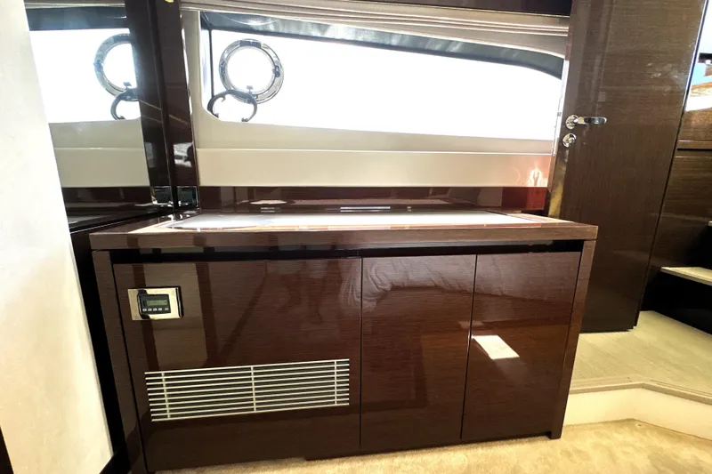 Lady Jane III Yacht Photos Pics 2023 Prestige 520 yacht interior with sleek wooden cabinetry and modern design elements.