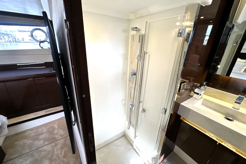 Lady Jane III Yacht Photos Pics Luxurious bathroom interior of 2023 Prestige 520 yacht with modern shower and vanity.