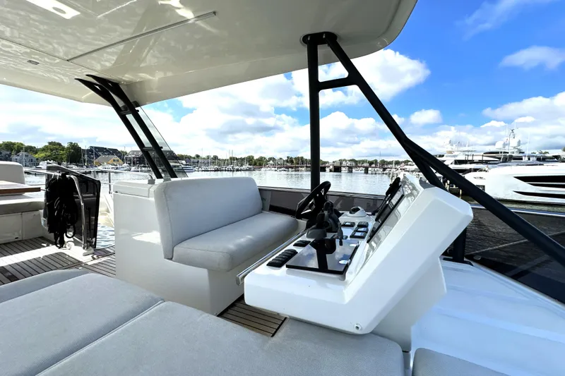 Lady Jane III Yacht Photos Pics Luxurious 2023 Prestige 520 yacht interior with helm, seating, and marina view.