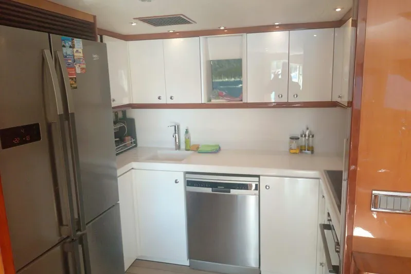  Yacht Photos Pics Modern kitchen interior on a 2005 Sunseeker 94 Yacht, featuring sleek appliances and cabinetry.