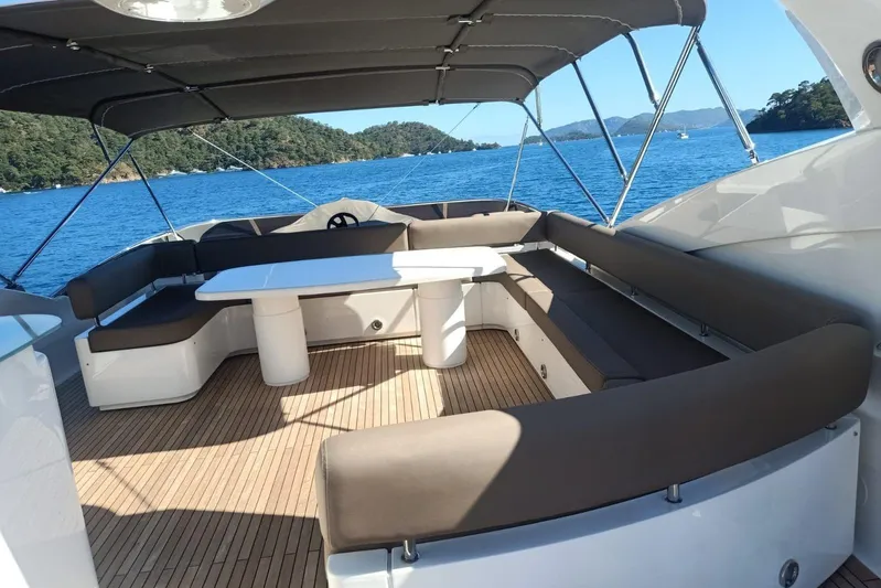  Yacht Photos Pics Luxurious Sunseeker 94 Yacht 2005 with spacious outdoor seating and scenic ocean view.