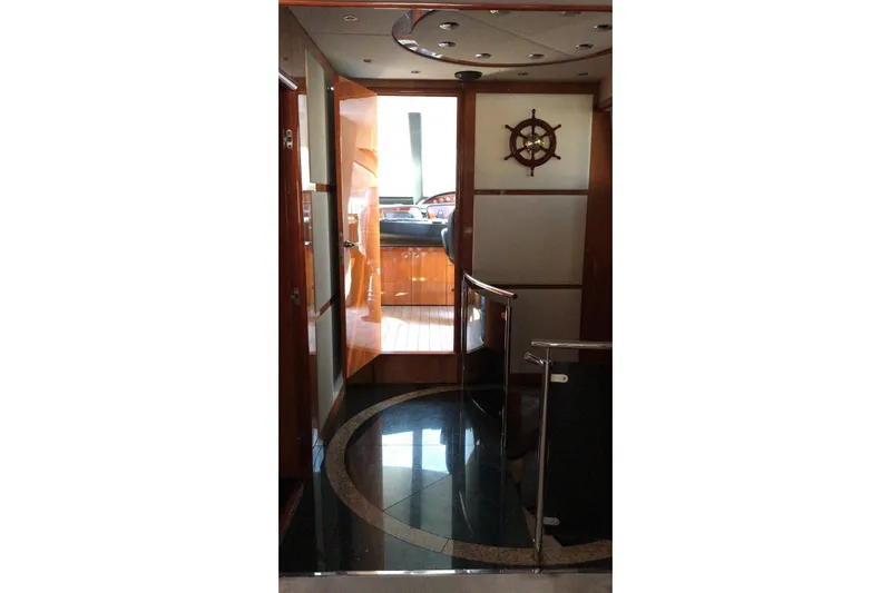  Yacht Photos Pics Luxurious interior of 2005 Sunseeker 94 Yacht with polished wood and nautical decor.