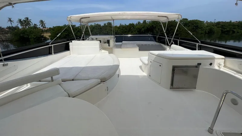 Etan Yacht Photos Pics Spacious deck of 2004 Ferretti Yachts 760 with white seating and canopy.