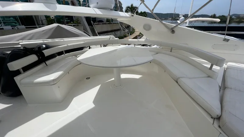 Etan Yacht Photos Pics Flybridge seating area on a 2004 Ferretti Yachts 760 with a round table.
