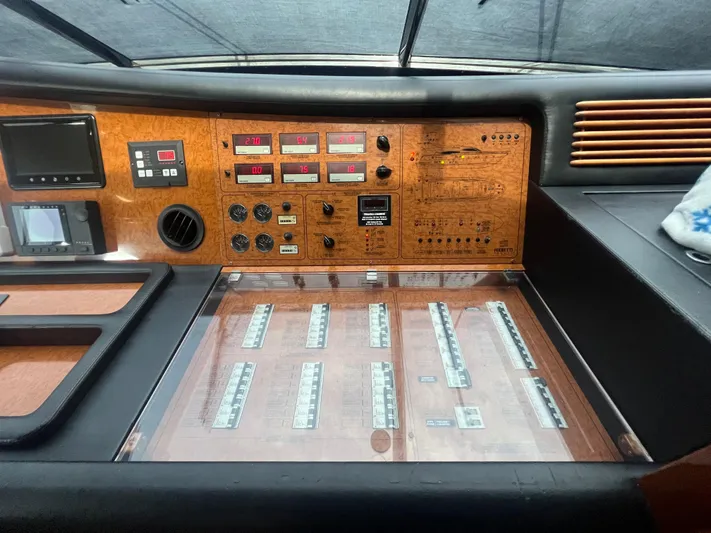 Etan Yacht Photos Pics Control panel of a 2004 Ferretti Yachts 760, featuring various gauges and switches.