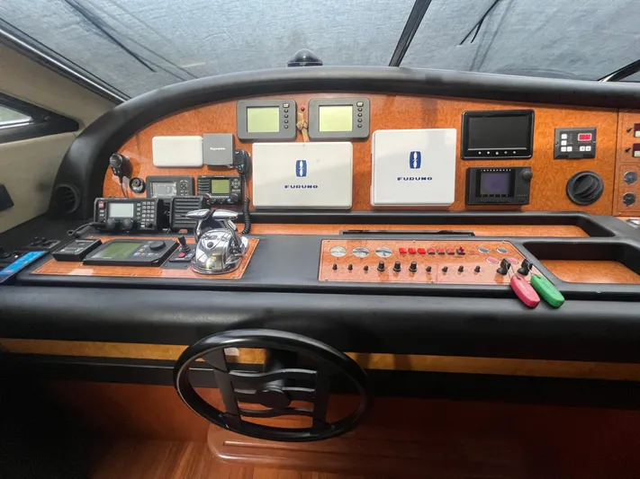 Etan Yacht Photos Pics Control panel of a 2004 Ferretti Yachts 760 with navigation and communication equipment.