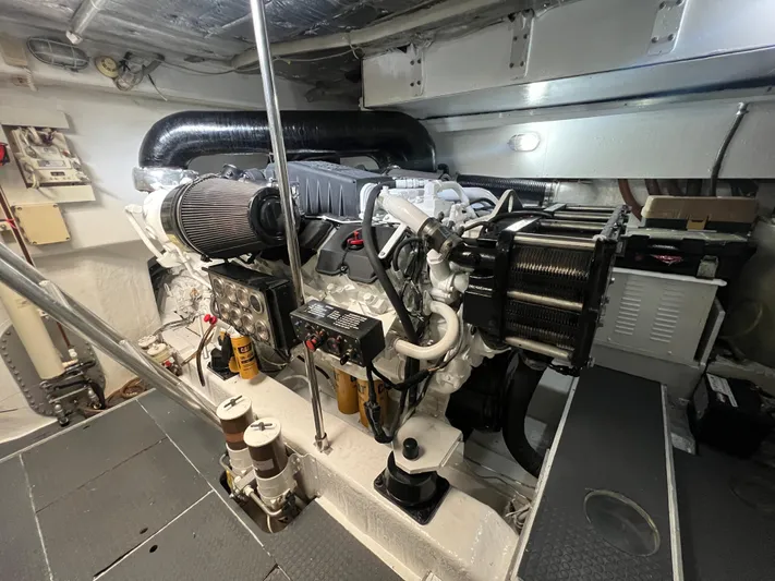 Etan Yacht Photos Pics Engine room of a 2004 Ferretti Yachts 760, showcasing the yacht's powerful engine.
