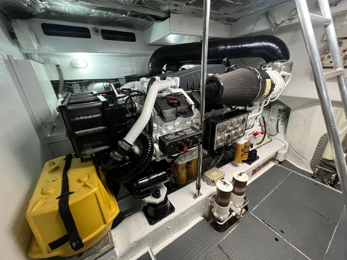 Etan Yacht Photos Pics Engine room of a 2004 Ferretti Yachts 760, showcasing the yacht's powerful engine.