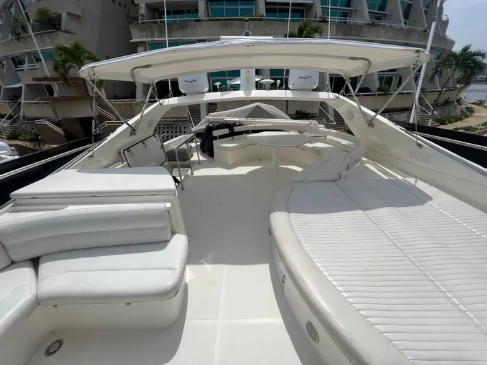 Etan Yacht Photos Pics Ferretti Yachts 760 2004 model, spacious deck with white seating and sunbathing area.