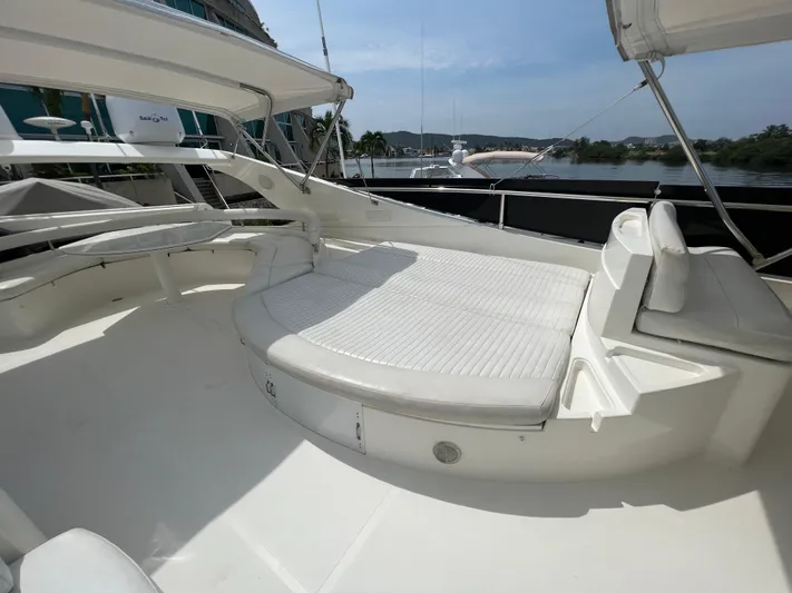 Etan Yacht Photos Pics 2004 Ferretti Yachts 760 flybridge with spacious sunbathing area and scenic water views.