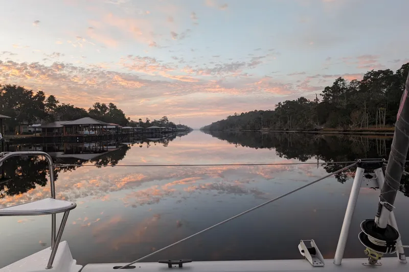 Changing Keys Yacht Photos Pics Sailing on a Leopard 40 catamaran at sunset, reflecting on calm waters, 2020 model.