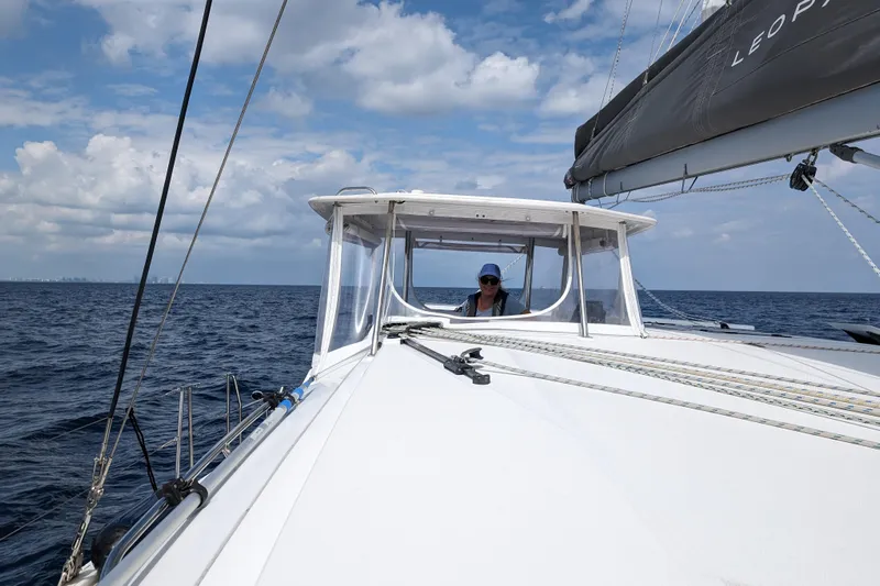 Changing Keys Yacht Photos Pics 2020 Leopard 40 catamaran sailing on open sea under a partly cloudy sky.