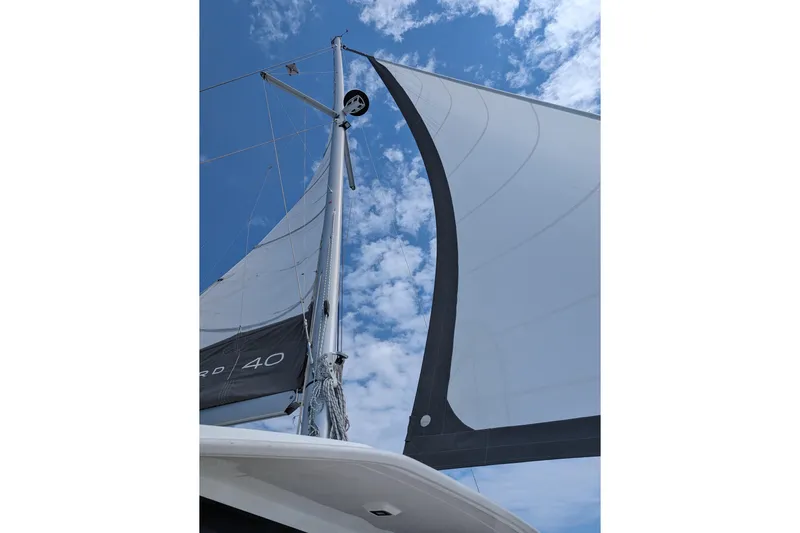 Changing Keys Yacht Photos Pics Sailing yacht Leopard 40, 2020 model, with sails unfurled against a blue sky.