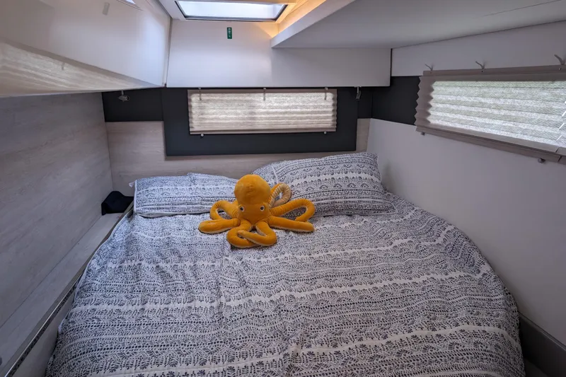 Changing Keys Yacht Photos Pics Cozy bedroom in 2020 Leopard 40 yacht with plush octopus on patterned bedding.